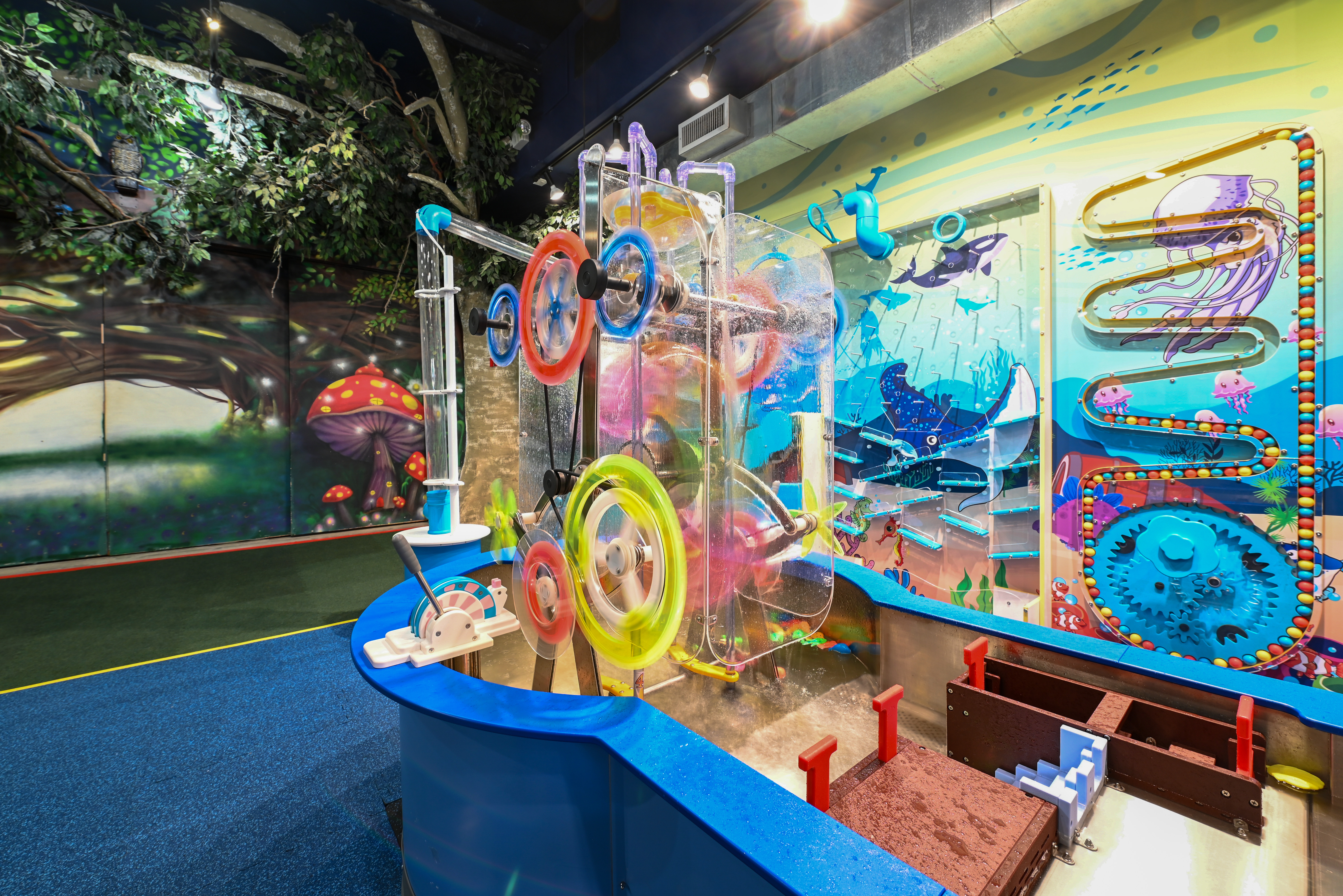 Children sliding down the indoor slides